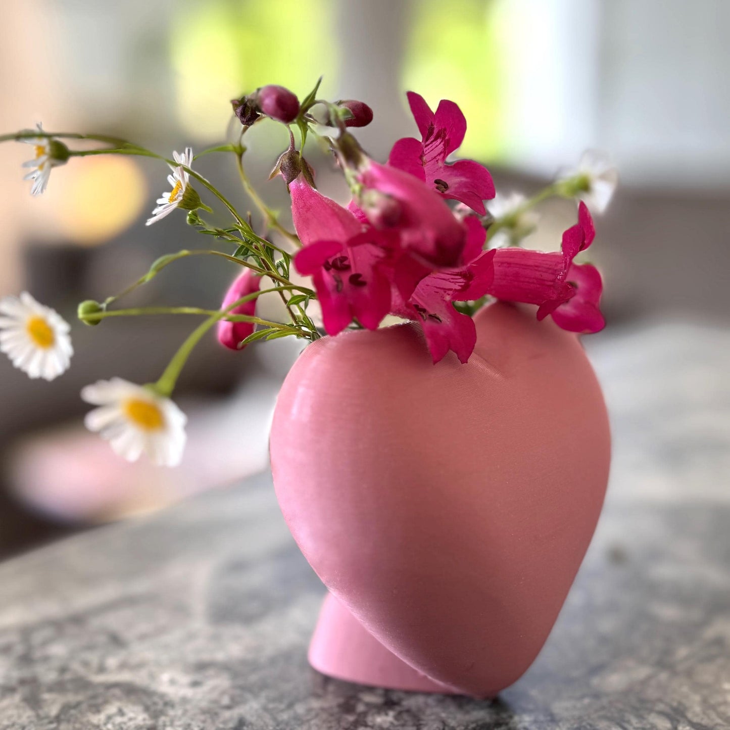 Heart shaped desktop storage pot. A vase for a few flowers or a place to keep makeup brushes, pens or pencils.