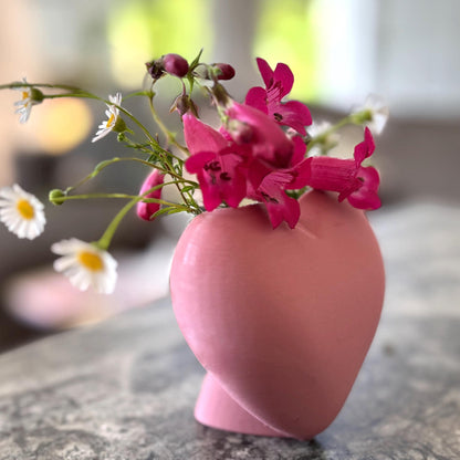 Heart shaped desktop storage pot. A vase for a few flowers or a place to keep makeup brushes, pens or pencils.